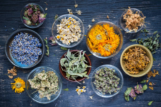 Steaming cup of herbal tea on a wooden table
